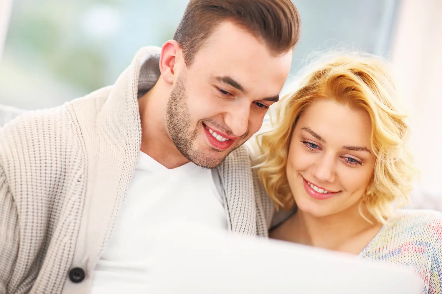 Couple looking at a laptop